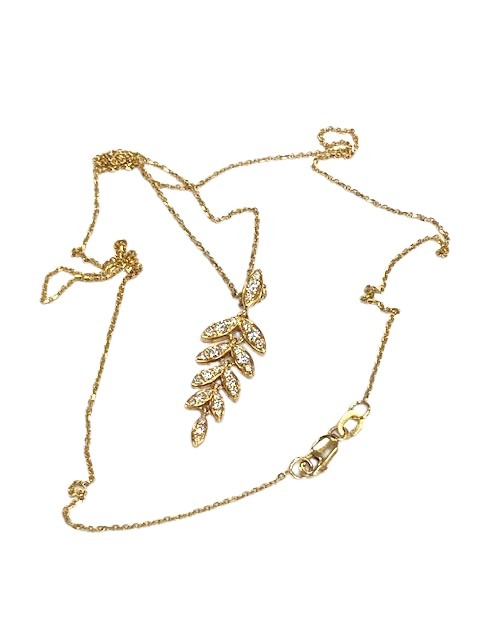 An 18ct yellow gold diamond leaf style pendant and chain
