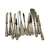 A collection of silver handled cutlery, button hooks,