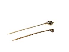 Two antique gold diamond set stick pins, about 0.