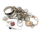 A collection of silver and white metal jewellery