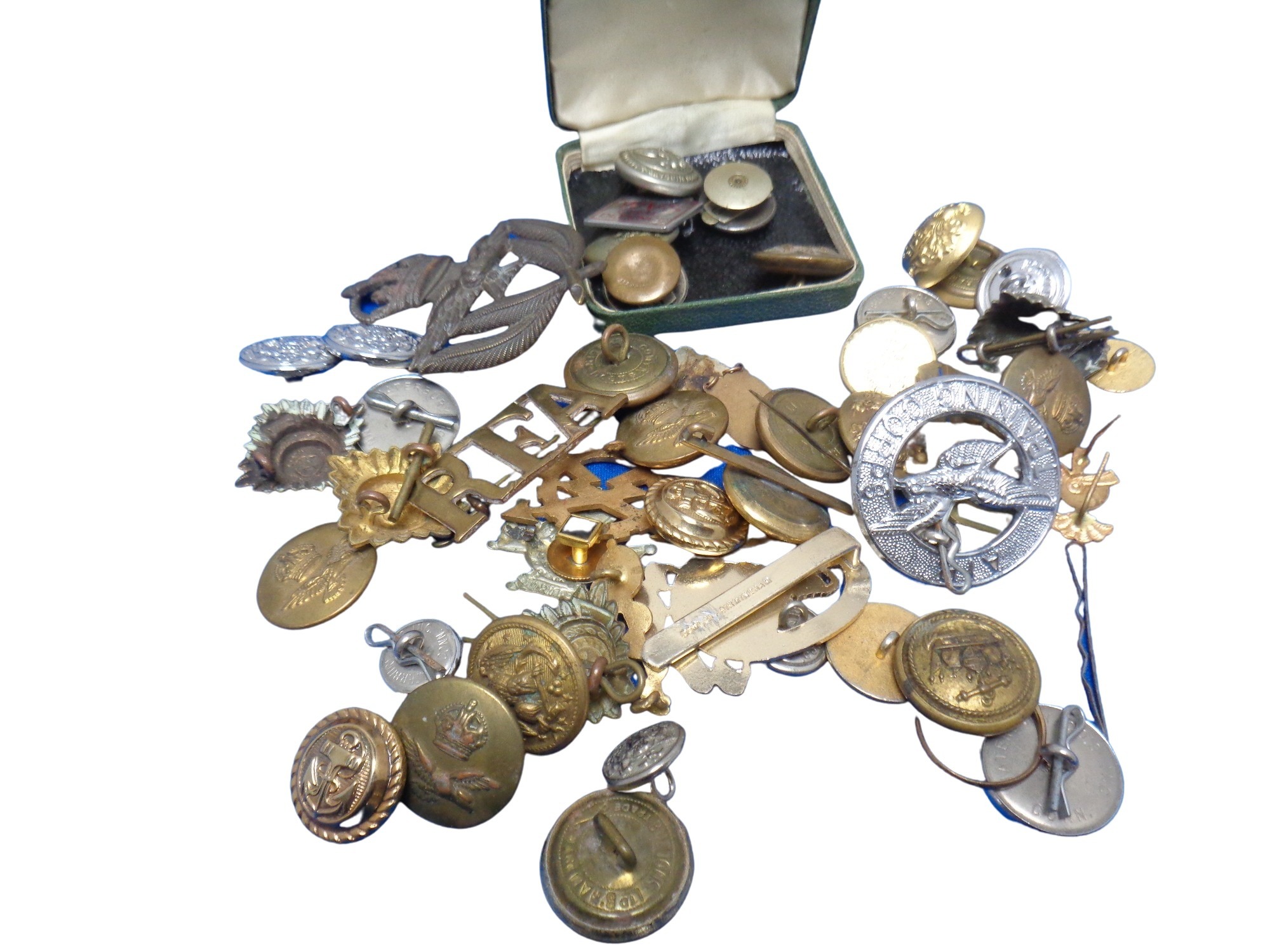 A quantity of mixed military cap badges and buttons,