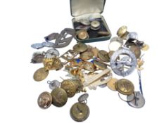 A quantity of mixed military cap badges and buttons,