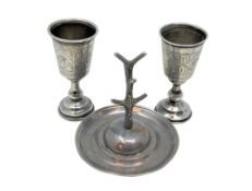 A pair of Edwardian silver goblets and an antique silver ring tree (3) CONDITION REPORT: