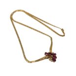 An 18ct gold ruby and diamond necklace, 12.45g. CONDITION REPORT: Chain length 42 cm.