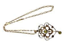 An antique gold peridot pendant and chain