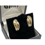 A pair of 18ct yellow and white gold diamond set earrings CONDITION REPORT: 7.