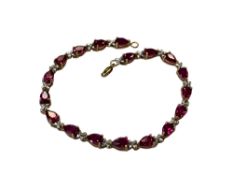 A gold simulated ruby bracelet CONDITION REPORT: 7.