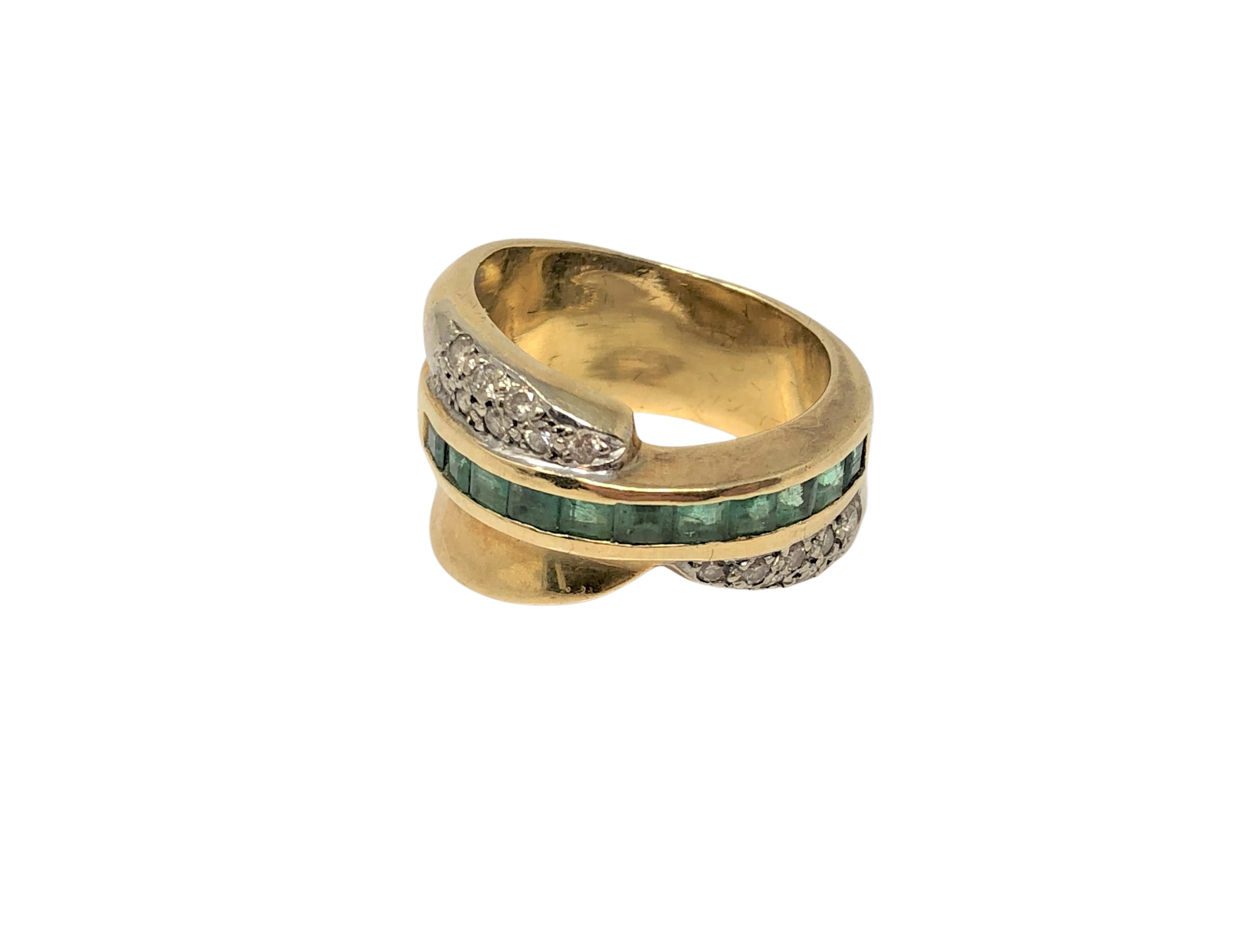 An 18ct gold emerald and diamond ring, size N CONDITION REPORT: 11.