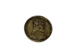 An antique medallion depicting Edward III