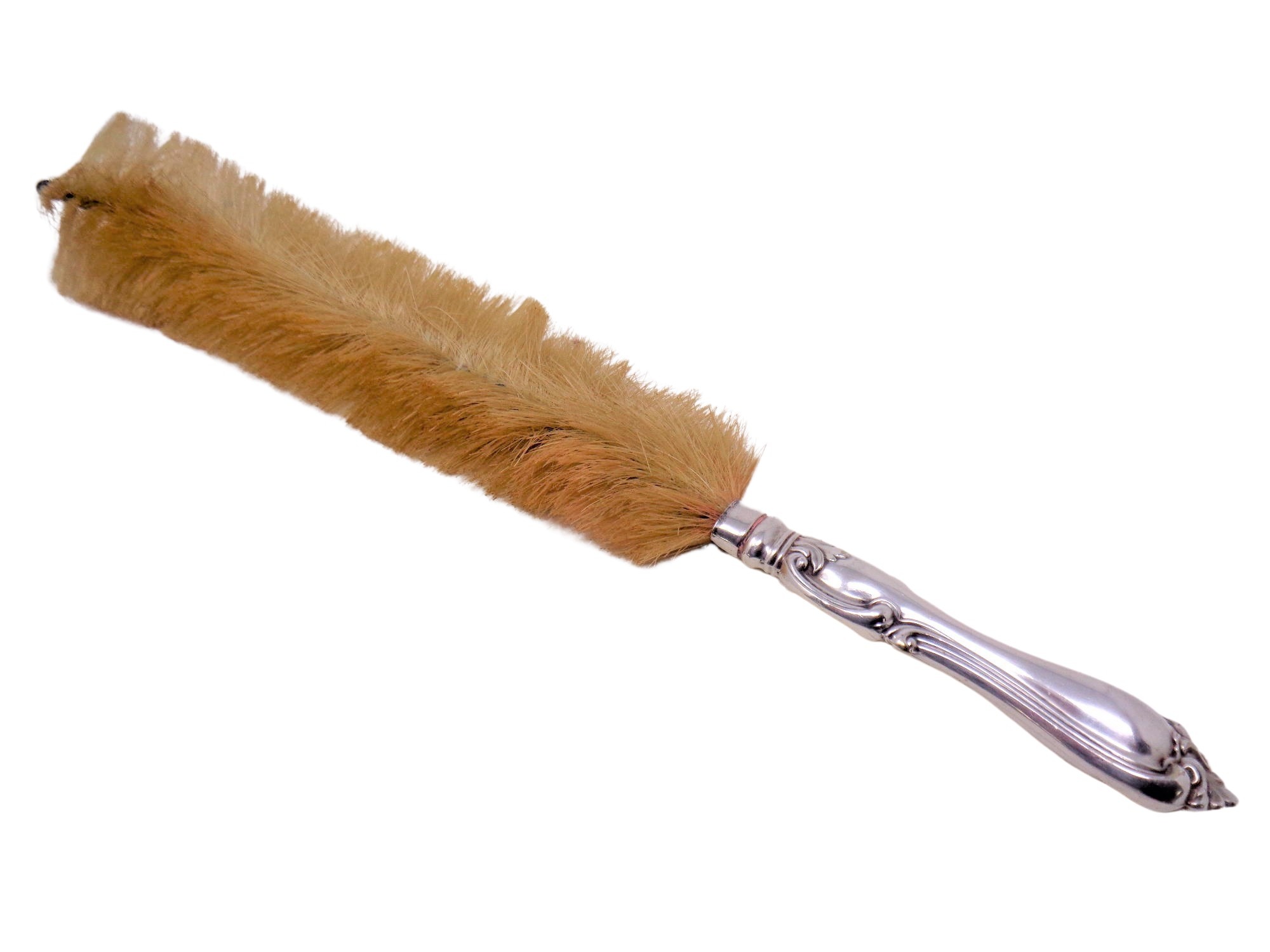 A silver handled brush