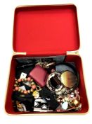 A carry case containing a quantity of costume jewellery, Stratton compact, beaded necklaces etc.