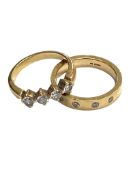 A two part engagement ring suite comprising of heavy 18ct gold band ring set with four diamonds (8.