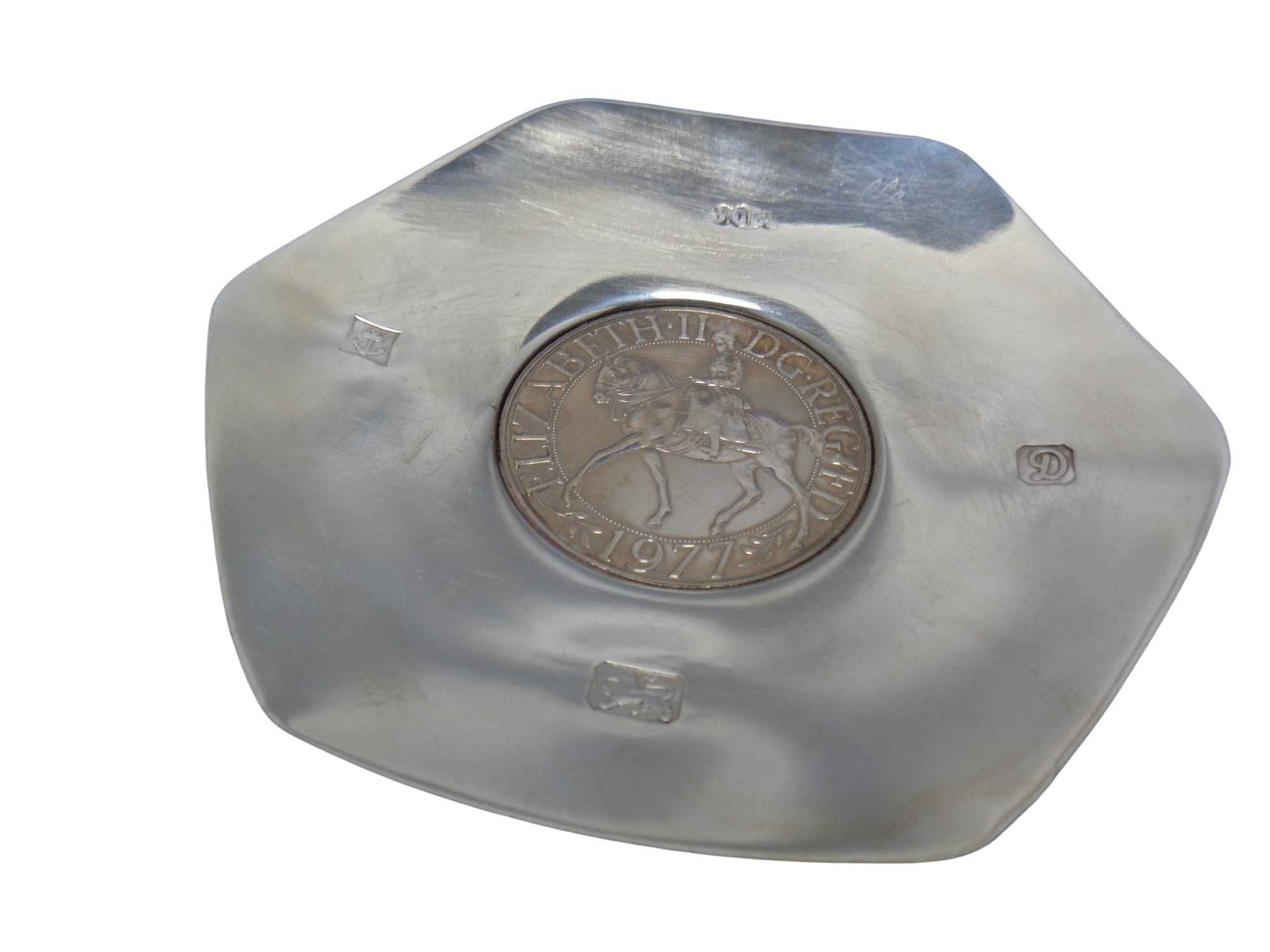 A small silver dish inset with a silver jubilee coin