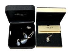 A Diamonfire silver pendant and matching earrings in box,