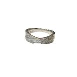 An 18ct white gold diamond set cross over band ring, size O/P.