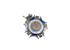 A silver and enamel medal for the Caledonian society of Johannesburg