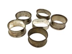 Six assorted silver napkin rings CONDITION REPORT: 82.