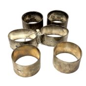 Three pairs of heavy gauge silver serviette rings, 314g.