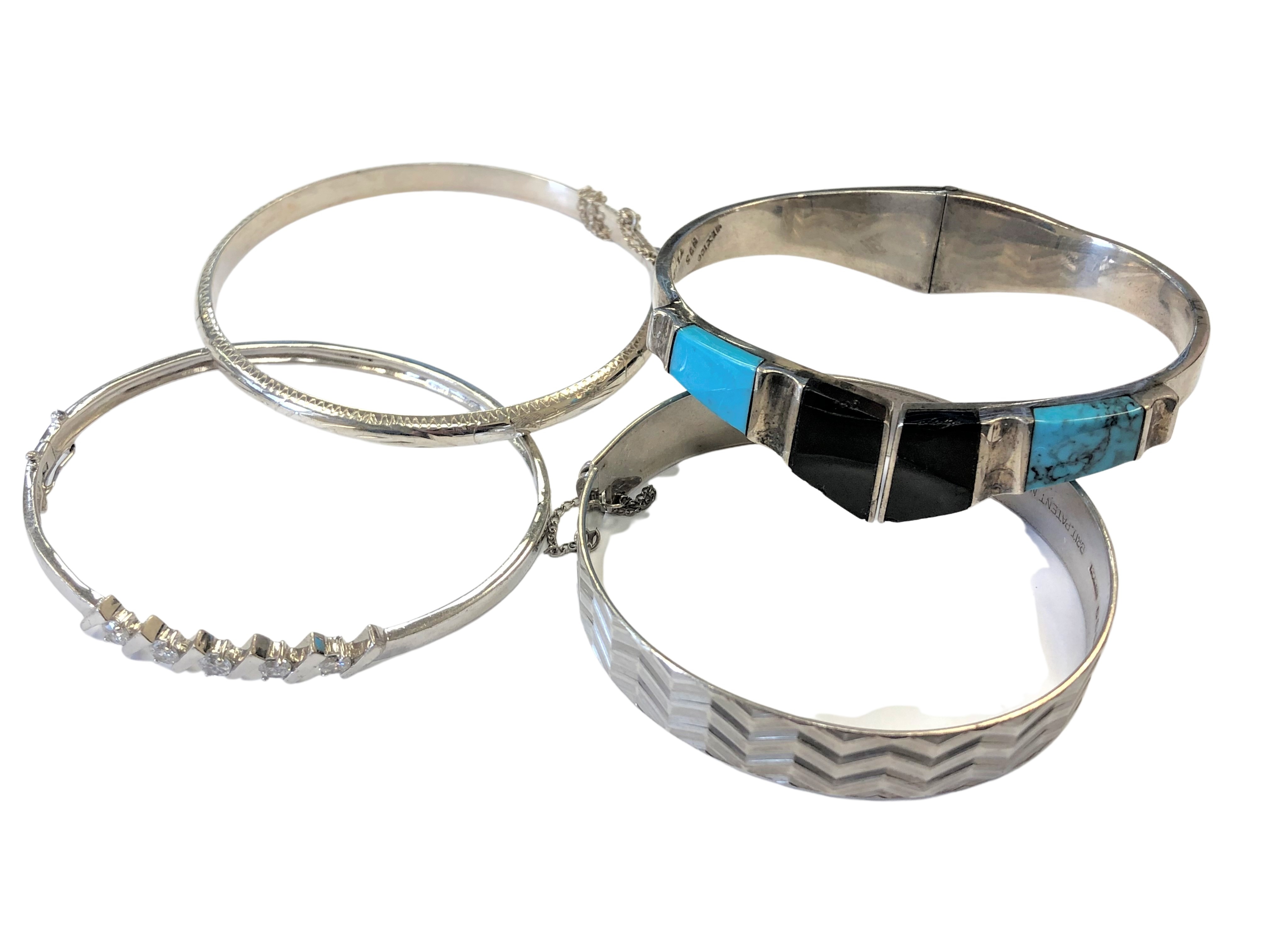 Four silver bangles