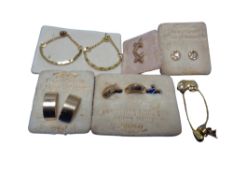 Six pairs of gold plated earrings