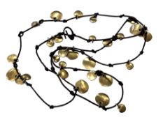 An unusual silver-gilt and leather necklace