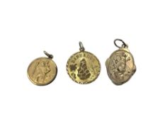 Three gold plated commemorative pendants