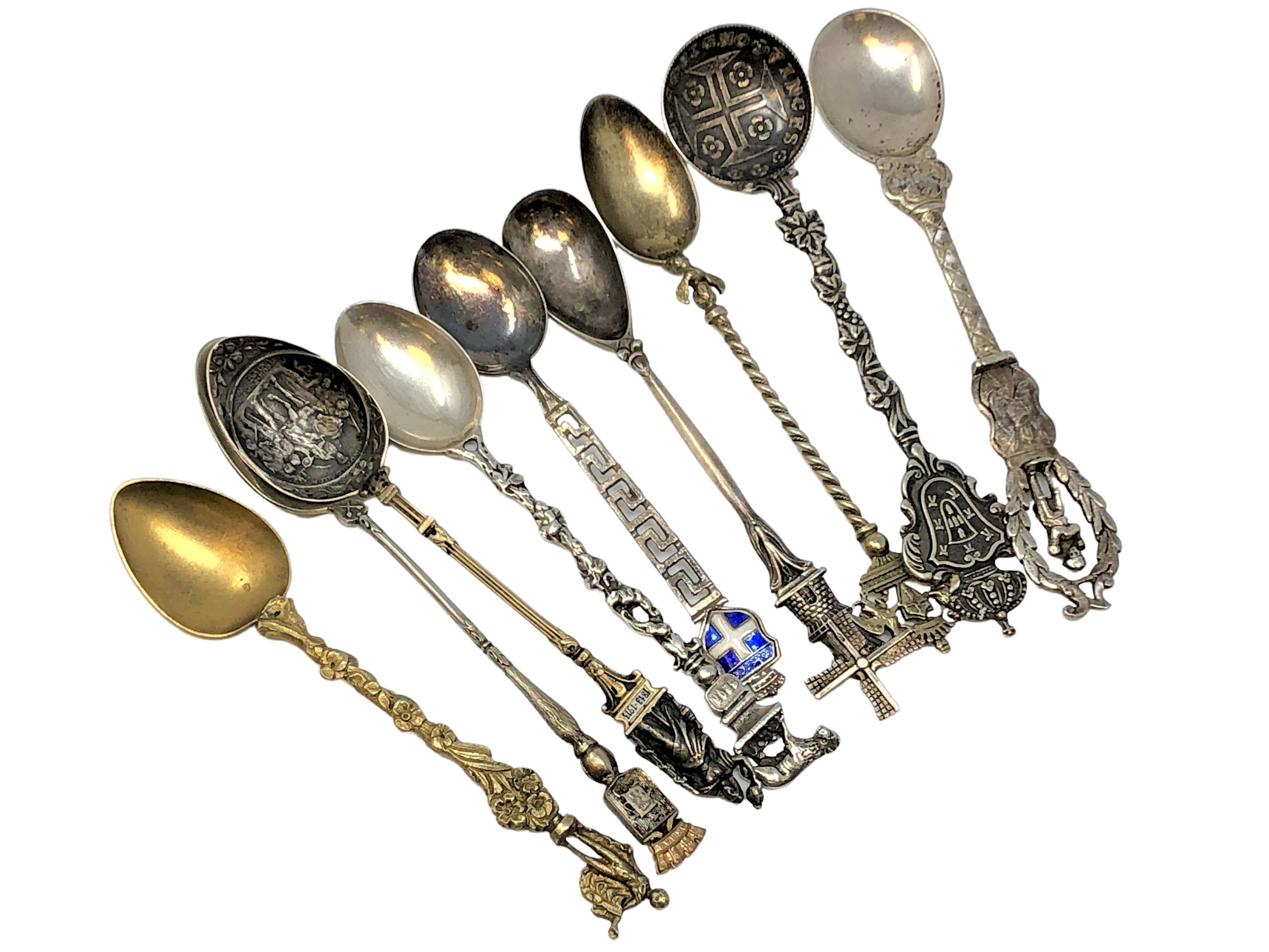 Nine highly ornate silver gilt and enamel spoons, including Napoleon.