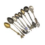 Nine highly ornate silver gilt and enamel spoons, including Napoleon.