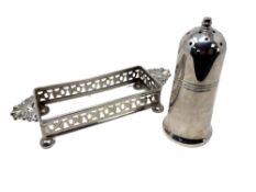 A silver plated table salt and bottle holder