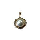 A 14ct gold mabe pearl pendant CONDITION REPORT: 6g