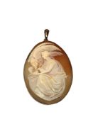 An antique 9ct rose gold cameo pendant depicting Leda and the Swan
