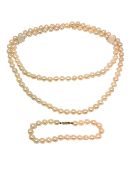 A cultured pearl necklace and similar bracelet with gold clasp