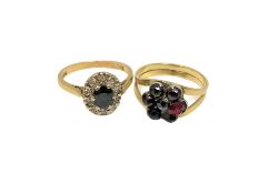 An 18ct gold sapphire and diamond ring and a gold garnet ring (2)