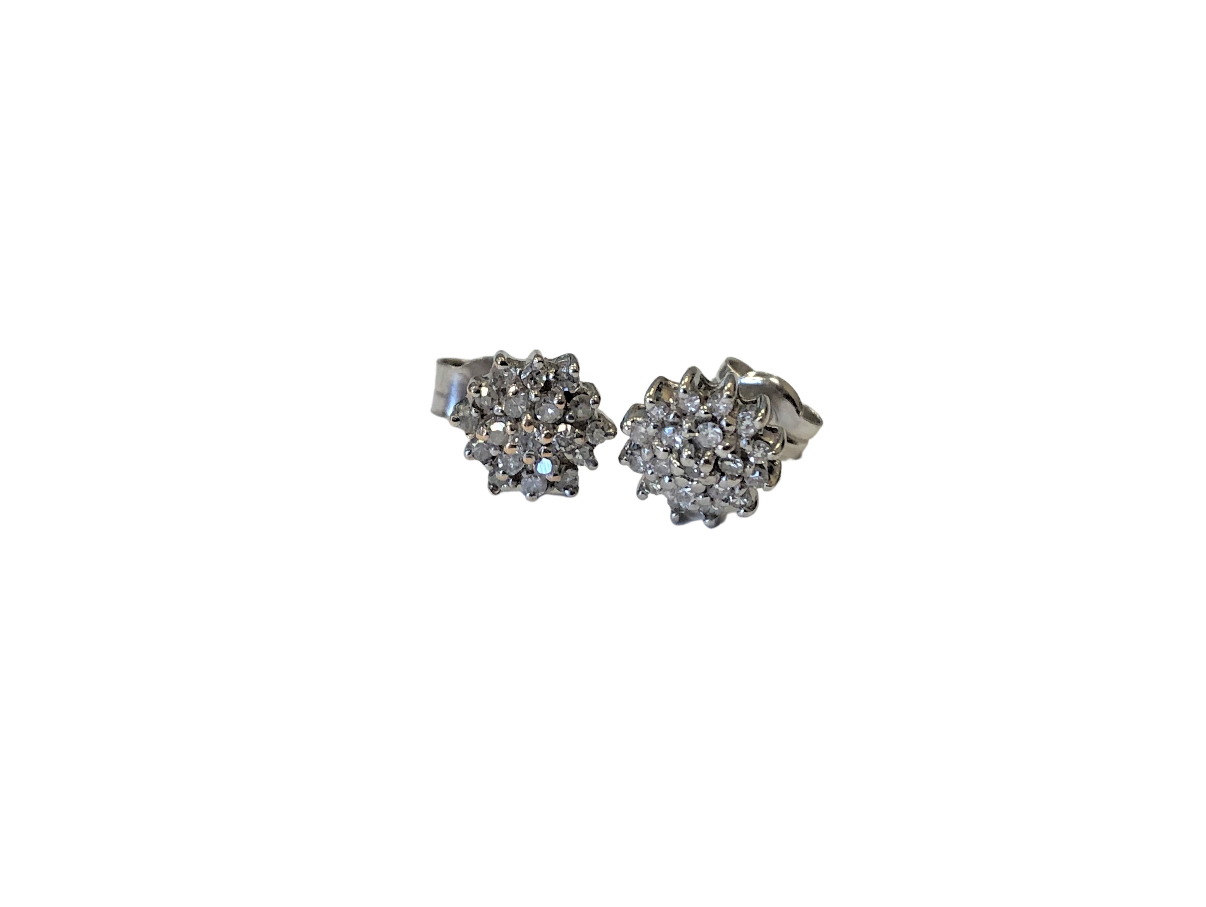 A pair of diamond cluster stud earrings