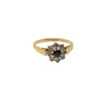 An 18ct gold sapphire and diamond cluster ring, size M CONDITION REPORT: 3.