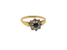 An 18ct gold sapphire and diamond cluster ring, size M CONDITION REPORT: 3.