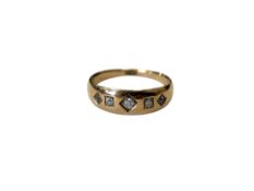 An antique 18ct gold five stone ring