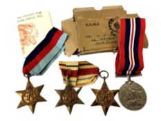 A group of four WWII medals named to signalman T Burton,