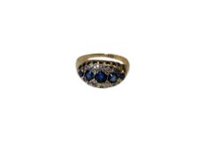 An antique 18ct gold sapphire and diamond ring