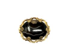 An antique gold and agate brooch