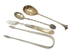A group of silver cutlery including pair of Georgian tongs,
