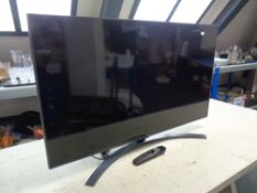 An LG model 43UP78006LB smart TV with remote