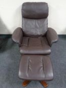 A brown leather manual adjustable reclining armchair with footstool