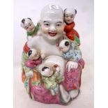 A Chinese glazed porcelain figure,