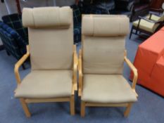 A pair of late 20th century lady's and gent's armchairs with head rests