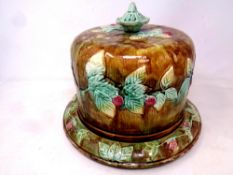 An antique Majolica cheese dish with cover CONDITION REPORT: Heavily crazed.