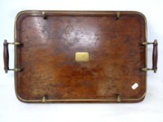 An Edwardian oak twin-handled serving tray with brass gallery