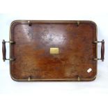 An Edwardian oak twin-handled serving tray with brass gallery