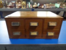 A mid 20th century desk top six drawer index chest
