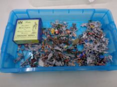 A crate of painted and non-painted cast figures